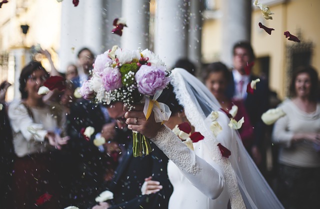 A woman getting married with a bunch of flowers