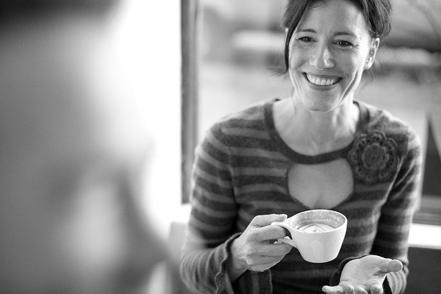 A woman on a date holding a coffee